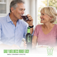Senior couple enjoying a glass of MonaVie Active during breakfast, showcasing a simple and convenient daily wellness routine.