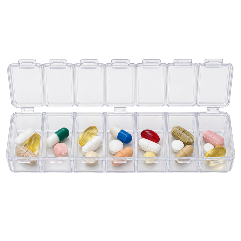 Clear pill organizer filled with mixed multivitamin capsules